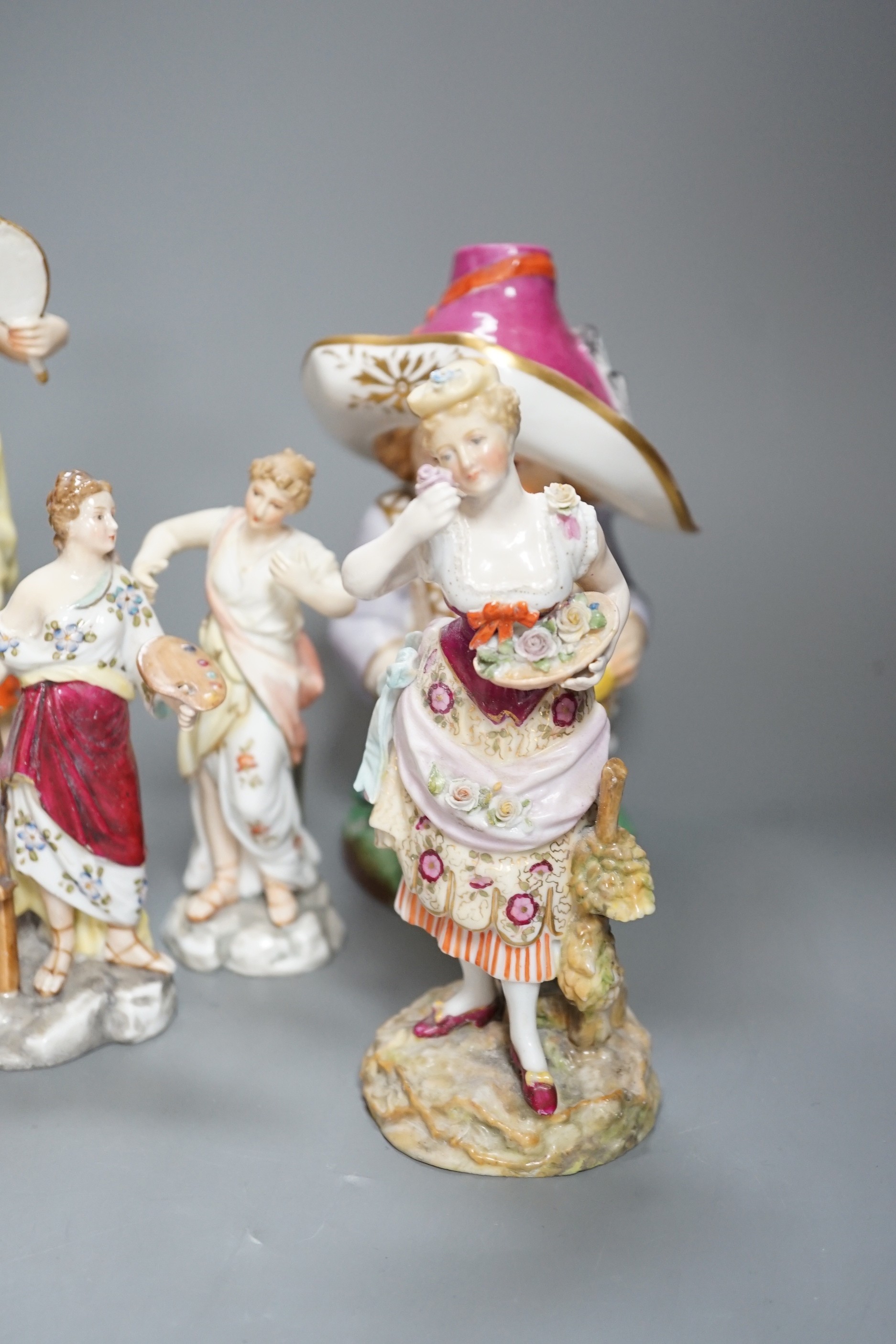 A selection of mainly Continental porcelain figures including Royal Crown Derby style mansion house dwarf